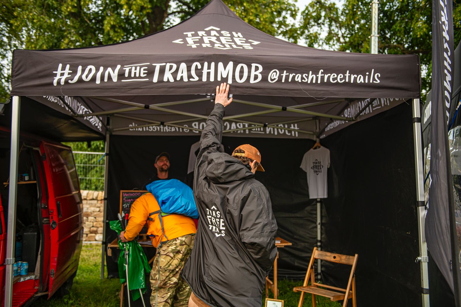 Trash Free Trails Dom Ferris Wearing Branded Ryde Poncho