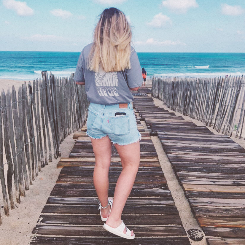 Emily Currie Surfer wearing Limited Edition Fools View Studio x Ryde Organic T Shirt